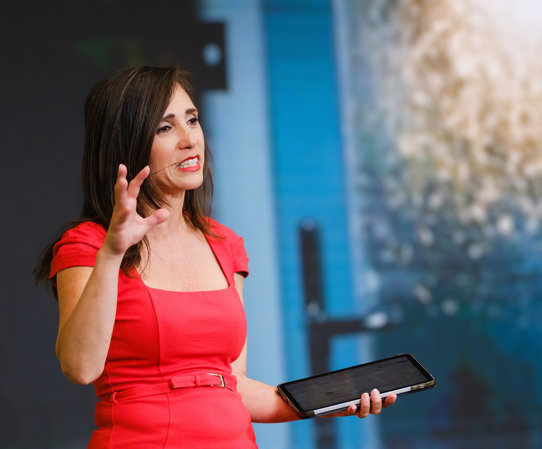 Livia Bernardini presenting on stage